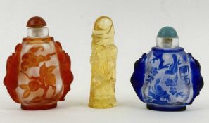 TWO CHINESE SCENT BOTTLES, carved blue overlaid glass, 6.5cms (h); and carved red overlaid glass,