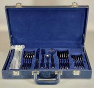 SUISSINE CANTEEN OF STAINLESS-STEEL CUTLERY with gold detail, 24 pieces, in blue case Provenance: