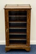 VICTORIAN WALNUT MUSIC CABINET, the top with gilded brass gallery, glazed single door enclosing five