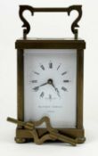 GILT BRASS FOUR-GLASS CARRIAGE CLOCK, Matthew Norman, London, signed white enamel dial with Roman