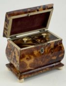 REGENCY TORTOISESHELL BOMBE FORM DOUBLE TEA CADDY, fitted interior, on four ivory ball feet, 12 (