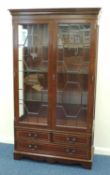 MAHOGANY TWO-DOOR BOOKCASE in the Georgian style, attributed to Beven Funnell, 183 (h) x 103 (w) x