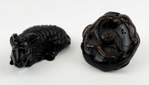 TWO 20TH CENTURY JAPANESE CARVED WOOD NETSUKE, goat, 6cms (l), and lotus leaf, 5cms (w), both having
