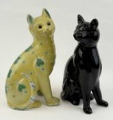 MOSANIC GALLE STYLE FAIENCE SEATED CAT, decorated with blue heart-form symbols on a yellow ground,