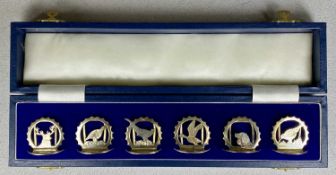 CASED SET OF SIX ELIZABETH II SILVER MENU HOLDERS, each pierced and decorated individually with