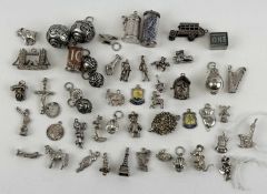LARGE ASSORTMENT OF SILVER / WHITE METAL CHARMS, including ten shillings and one shilling, approx.