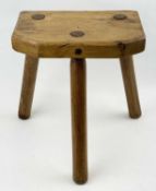 SYCAMORE & ASH MILKING STOOL, rectangular slab seat with canted corners, raised on three shaped