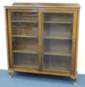 GEORGE V STAINED WOOD SLIDING DOOR BOOKCASE, 134 (h) x 125 (w) x 34cms (d) Provenance: private