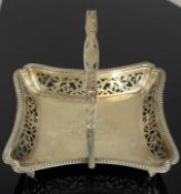 EDWARD VII RECTANGULAR SILVER SWING-HANDLED DISH, gadrooned and pierced border, on four claw feet,