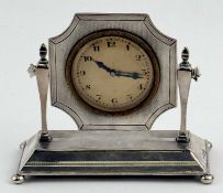 GEORGE V ART DECO SILVER DESK CLOCK, on swivel stand with bun feet, circular dial with gilt bezel