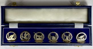 CASED SET OF SIX ELIZABETH II SILVER MENU HOLDERS, each pierced and decorated individually with