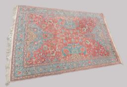 TURKISH RED GROUND WOOLLEN CARPET, in the Persian style, 294 x 196cms (cut down) Provenance: private