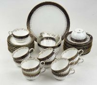 WEDGWOOD TEAWARE with cobalt blue and gilt patterned border, pattern X5879, 40 pieces Provenance: