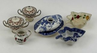 PAIR OF WEDGWOOD CREAMWARE TWO-HANDLED CUPS & COVERS, with red floral patterns and black outlines,