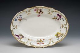 NANTGARW PORCELAIN OVAL DISH of lobed form, typically moulded with c-scrolls, forget-me-nots, and