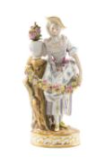 MEISSEN PORCELAIN FIGURE OF A GARDENER, maiden dressed in 18th century costume holding a garland,