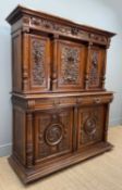 LATE 19TH C. FRENCH HENRY II STYLE CARVED WALNUT CABINET, decorated with carved swags and scrolls,