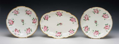 THREE SWANSEA PORCELAIN CRUCIFORM DISHES, solid gilt rims, decorated with a sequence of open pink