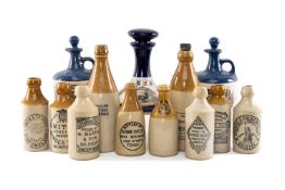 COLLECTION OF STONEWARE GINGER BOTTLES & CERAMIC DECANTERS, some of Welsh interest, inc. three