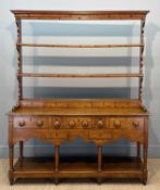 GEORGE III OAK WELSH DRESSER, c. 1820, open rack with five spice drawers, base with a further