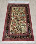 SMALL PERSIAN SILK RUG, Isfahan or Goum, the field with Tree of Life design, including exotic