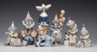SIX LLADRÓ CHINA FIGURINES OF CLOWNS, various poses with balloons, beach balls, etc., together