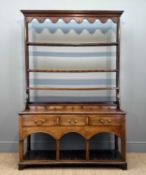 GEORGE III OAK WELSH DRESSER, open rack, above base fitted with five spice drawers, three frieze