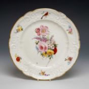 NANTGARW PLATE, moulded border, gilt dentil rim, border with cartouches of flowers, hare?, and bird,