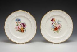 PAIR OF NANTGARW PORCELAIN PLATES, typical moulded borders with c-scrolls, forget-me-nots, and