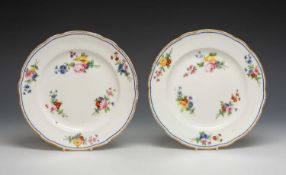 PAIR OF NANTGARW PORCELAIN PLATES of lobed form, non-moulded, with gilt dentil rim, decorated with