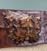 DECORATIVE 'GREEN MAN' CARVED OAK PANEL, central face flanked by Tudor roses and oak leaves carved