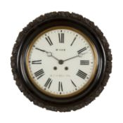 LATE 19TH C. EBONISED DIAL WALL CLOCK, carved with fruit and foliage, glazed door with brass
