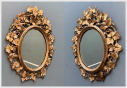 PAIR GILT GESSO OVAL MIRRORS, fruiting vine surround, 47cms (h) (2) Provenance: private collection