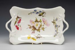 SWANSEA PORCELAIN TWIG-HANDLED DISH, non-moulded and non-gilded, decorated with enamelled flowers,