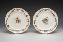 PAIR OF NANTGARW PORCELAIN PLATES, coned border, gilt dentil rim, trailing flowers to the border,