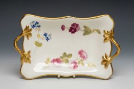 SWANSEA PORCELAIN TWIG-HANDLED DISH, handles picked out in gold with leaf terminals, solid gilt rim,
