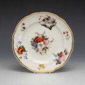 NANTGARW PORCELAIN PLATE, having a wavy border and solid gilt rim, decorated with colourful