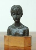 FOLLOWER OF JACOB EPSTEIN (1880-1959) BRONZE BUST OF A YOUNG WOMAN, mounted on an oak plinth,