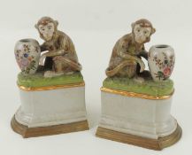 PAIR OF BRASS MOUNTED PORCELAIN MONKEY BOOK ENDS, late 20th century, 23cms (h) Provenance: The