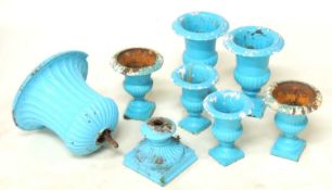 THREE PAIRS OF CAST IRON SMALL CAMPAGNA URNS, being 34, 28, and 25cms (h); together with a further