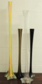 THREE COLOURED GLASS STEM VASES, tallest finished in streaky yellow and orange, 90cms (h), the