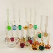 COLLECTION OF COLOURED GLASS STEM VASES, with paperweight bases, tallest 26cms (h), smallest