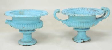 PAIR OF PAINTED CAST IRON SHALLOW GARDEN URNS, in the Romanesque style, both with damage and losses,