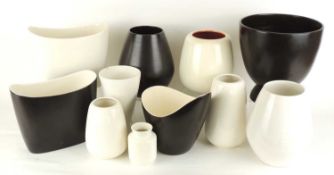 POOLE BLACK PANTHER & MAGNOLIA GLAZED VASES, in 'contemporary' shapes, comprising a large black