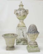 WELL WEATHERED TERRACOTTA LIDDED GARDEN URN, with lion's mask lug handles, raised on a textured