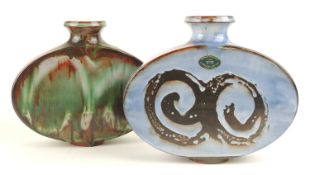 LLANGOLLEN POTTERY BLUE GLAZED OVAL FLASK, 20.5cms (h); together with a Llangollen pottery streaky