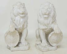 PAIR OF DECORATIVE WHITE CRACKLE GLAZED ARMORIAL LIONS, 60cms (h) Provenance: The collection of
