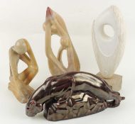 TWO DECORATIVE CARVED SOAPSTONE FIGURES in the modernist style, 31cms (h); together with a modern