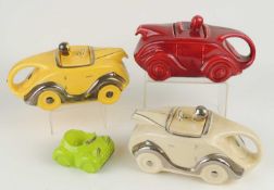 SADLER MOTORCAR TEAPOT, finished in red glaze, 22cms; together with a cream and silver glazed