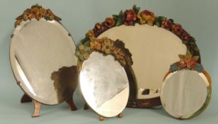 FOUR DECORATIVE BARBOLA FLORAL MOUNTED MIRRORS, three having easel frames, largest 37cms, one